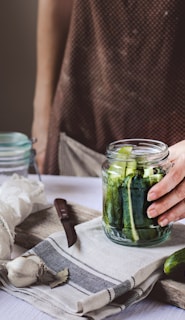 pickle jar on white textile