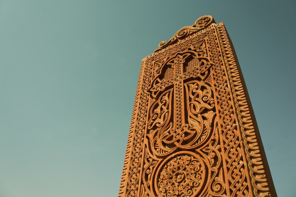 brown concrete cross statue