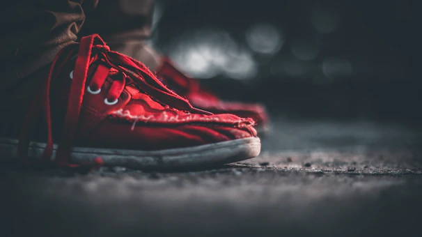 Close-up of worn All Star sneakers showing the texture and character of years of use.
