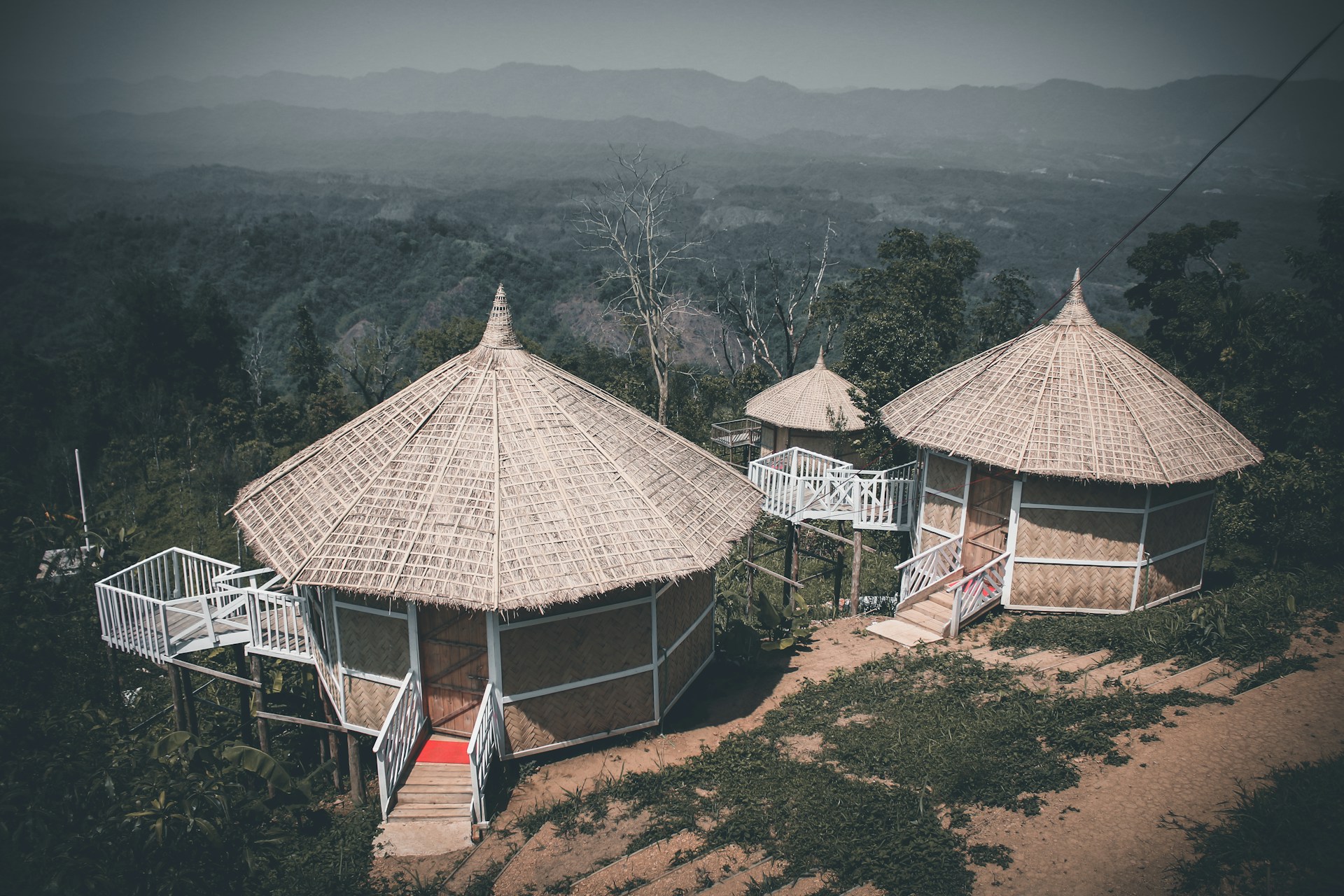 woman wearing yellow long-sleeved dress under white clouds and blue sky during daytime