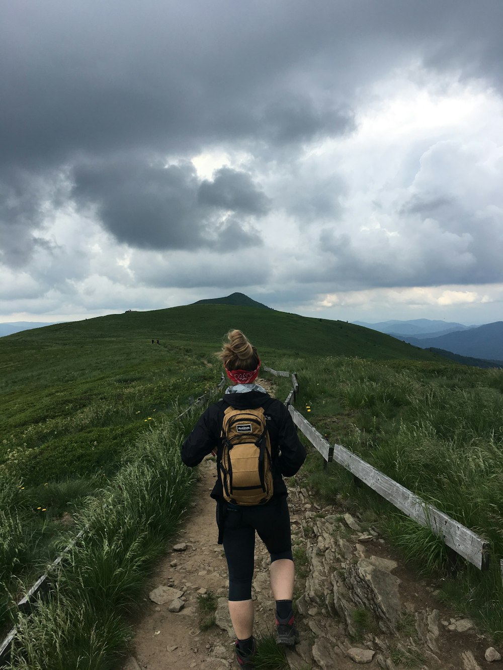 woman walking on hill