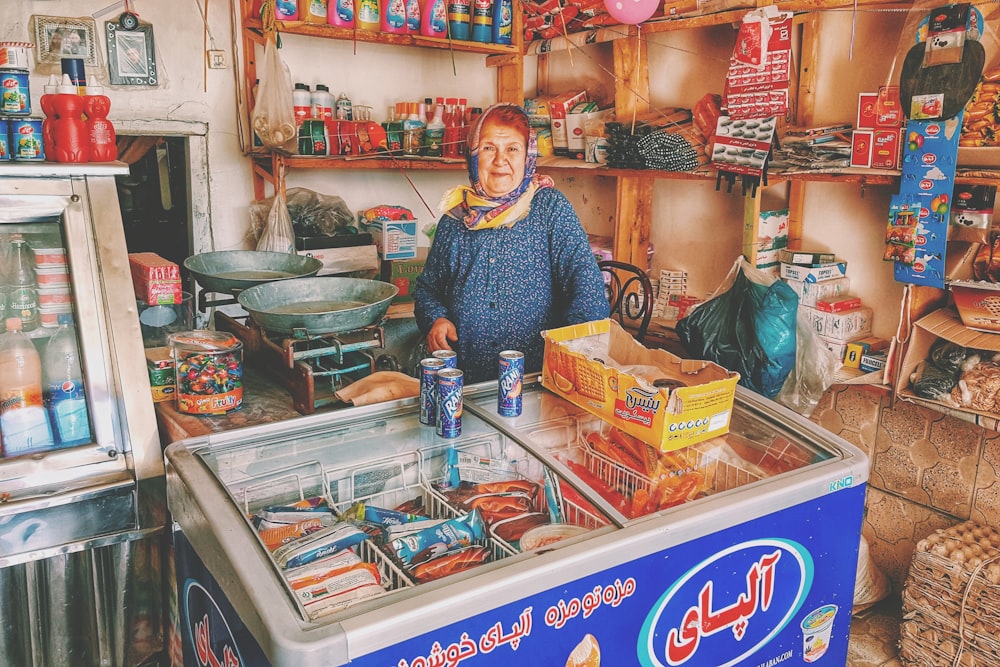 person in front of Pepsi cans