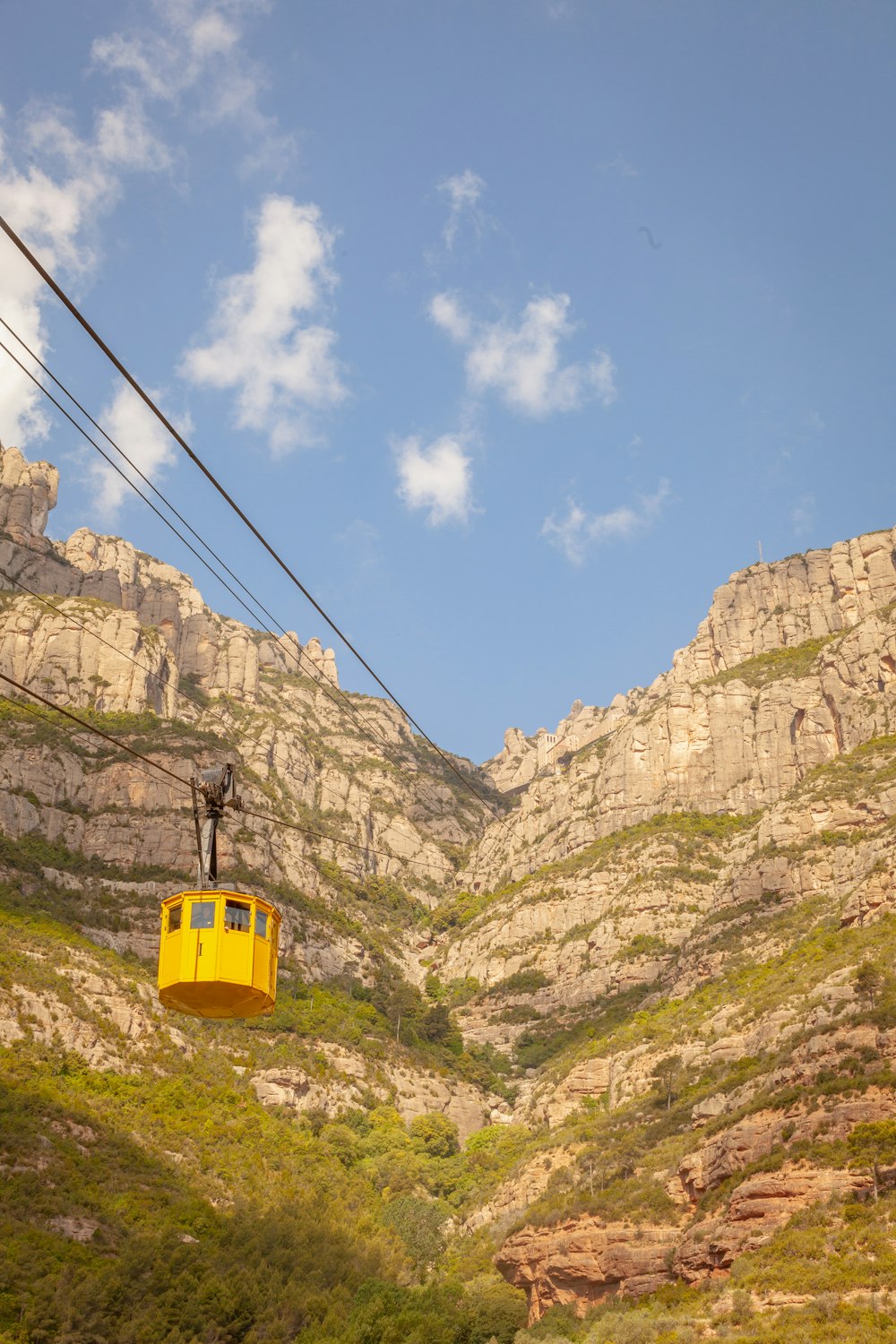 yellow tram near mountain