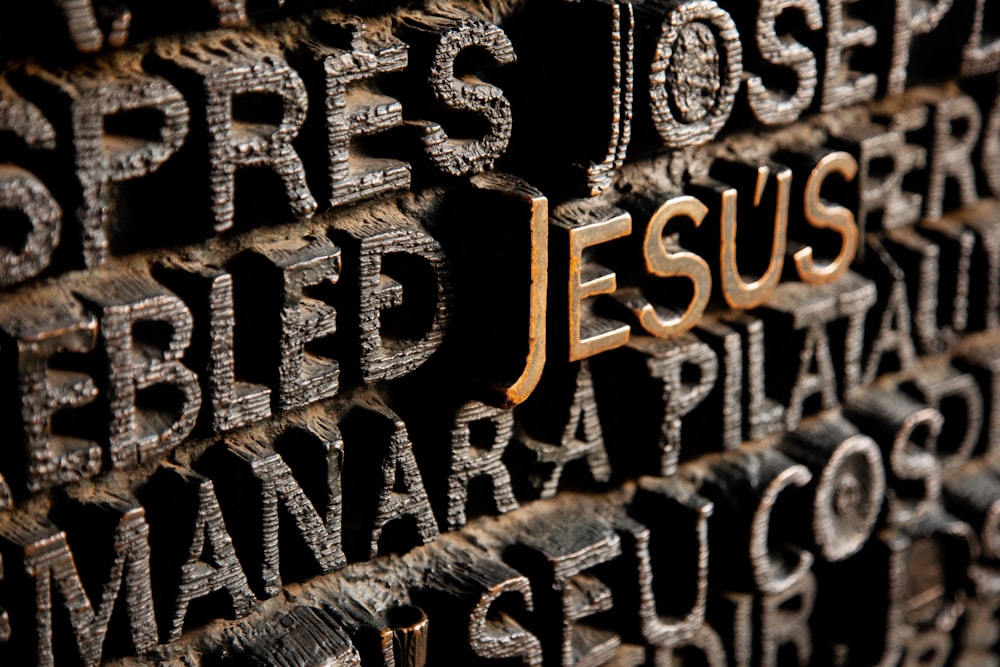 gold Jesus embossed letters
