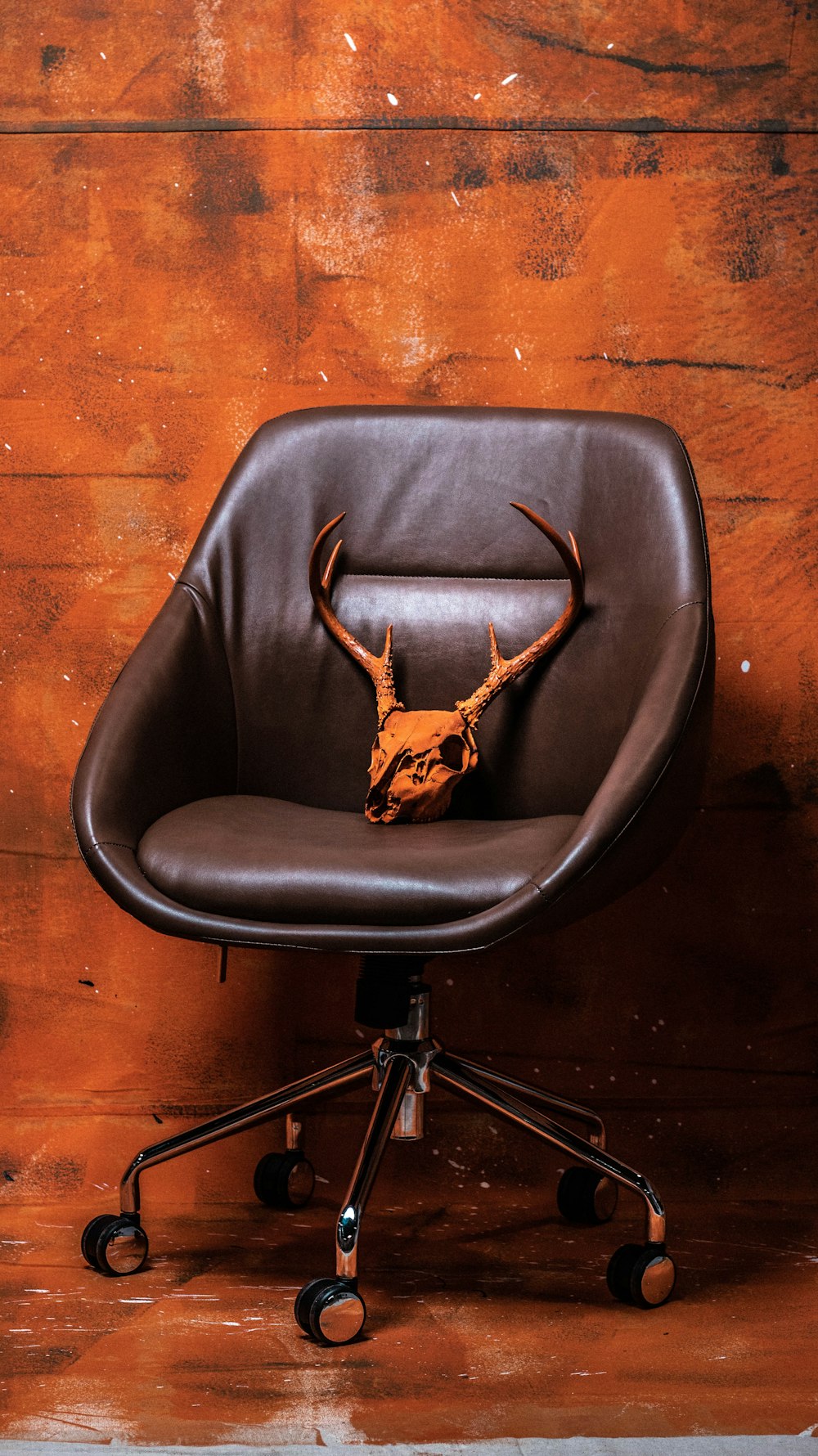 brown leather rolling chair