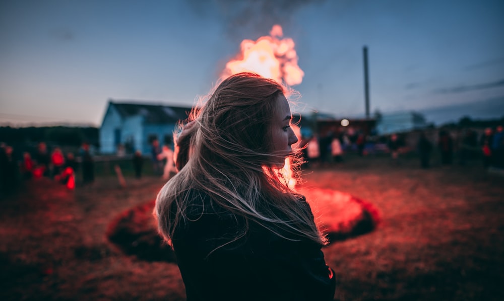 women near a fire camp during daytime