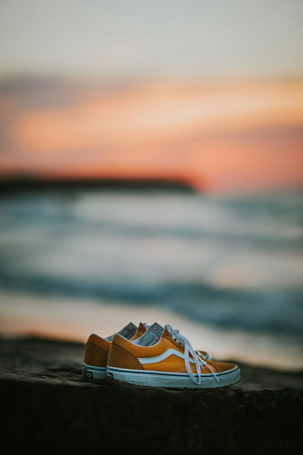 pair of yellow Vans Old Skool low-top sneakers