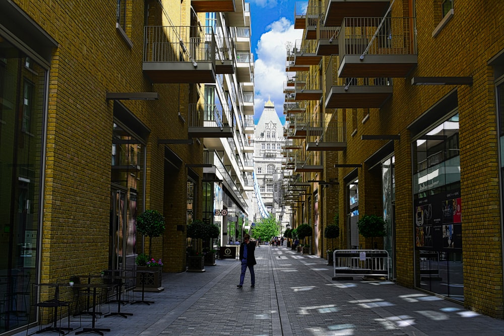 person standing between buildings