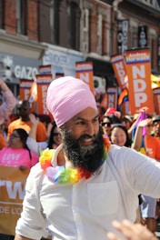 Parminder Singh Bhamra engaging warmly with community members during a local event.