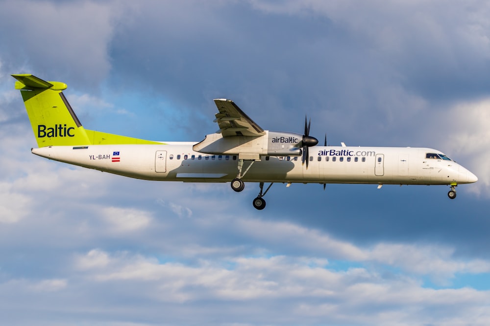 white and yellow Baltic airliner