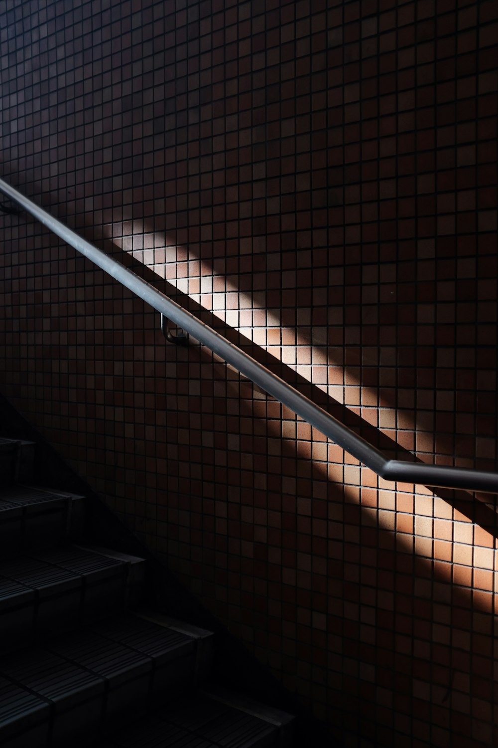 staircase with wall handrail