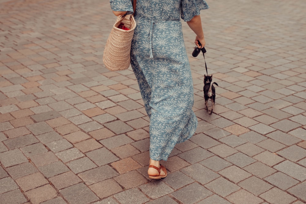 woman in blue and white floral dress