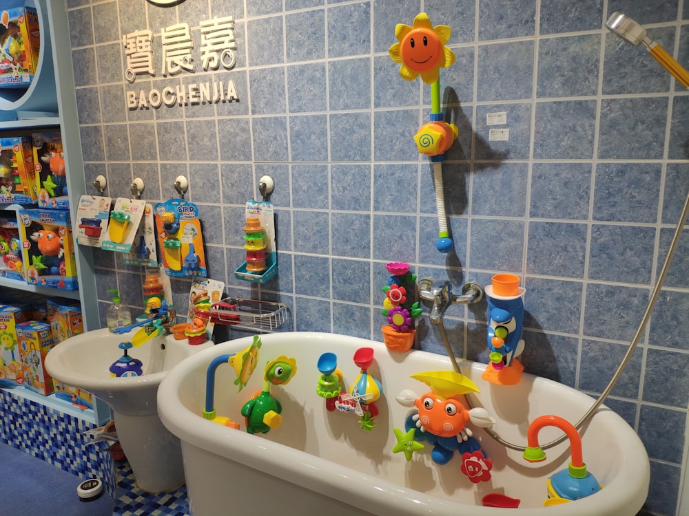 assorted-colored plastic toys hanging on bathtub