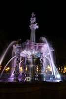 A breathtaking view of the Dubai Fountain illuminated at night.
