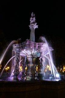 Beautifully lit fountain in the expansive lawn, perfect for evening gatherings