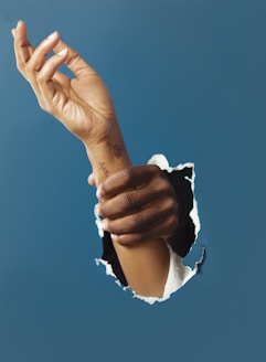 person holding right hand of another person