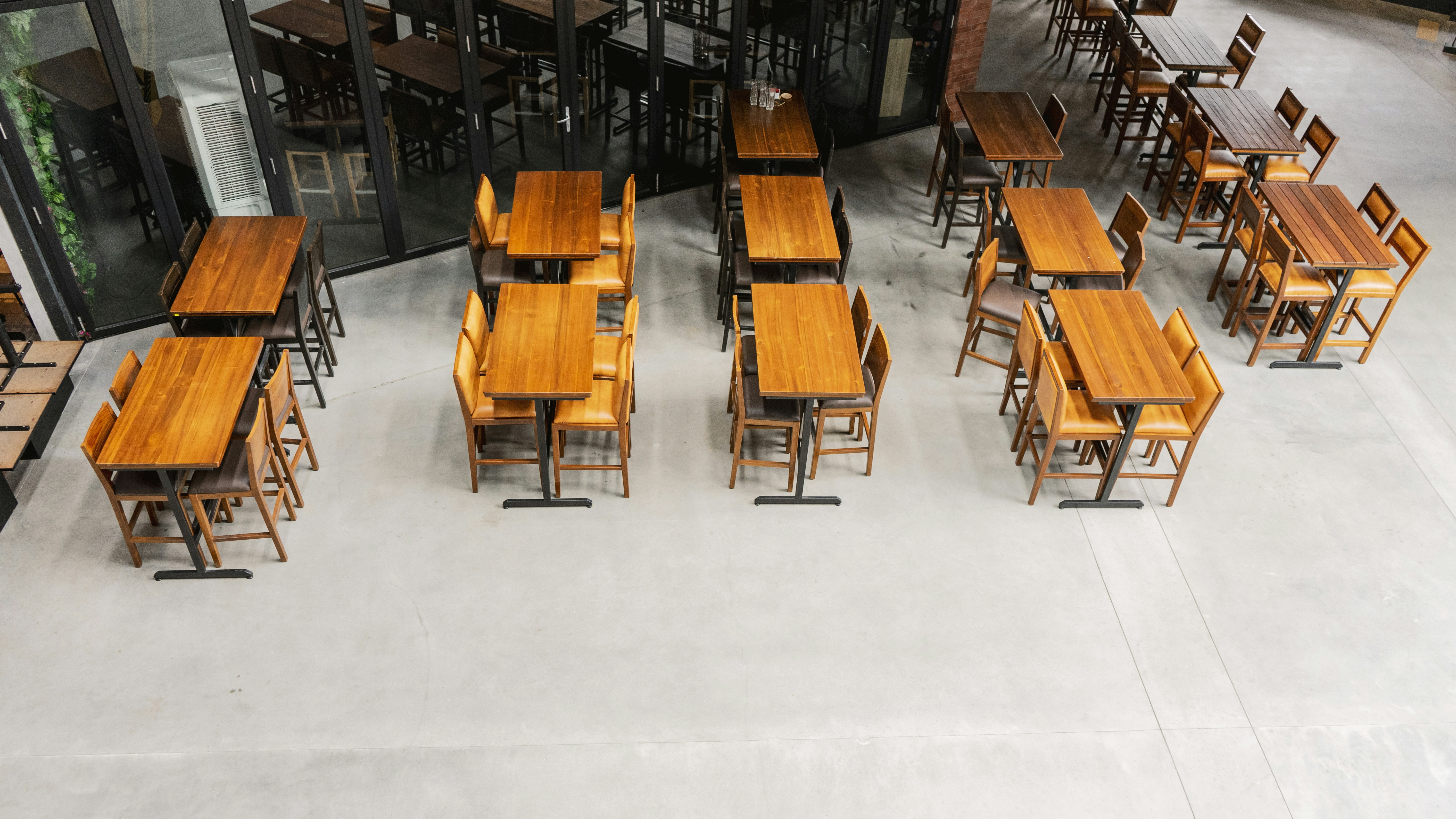 A person happily assembling a new piece of furniture in their home.