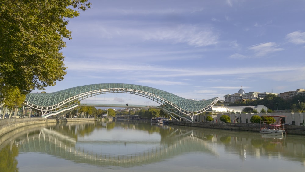 white and green bridge under blue and white sky at daytime