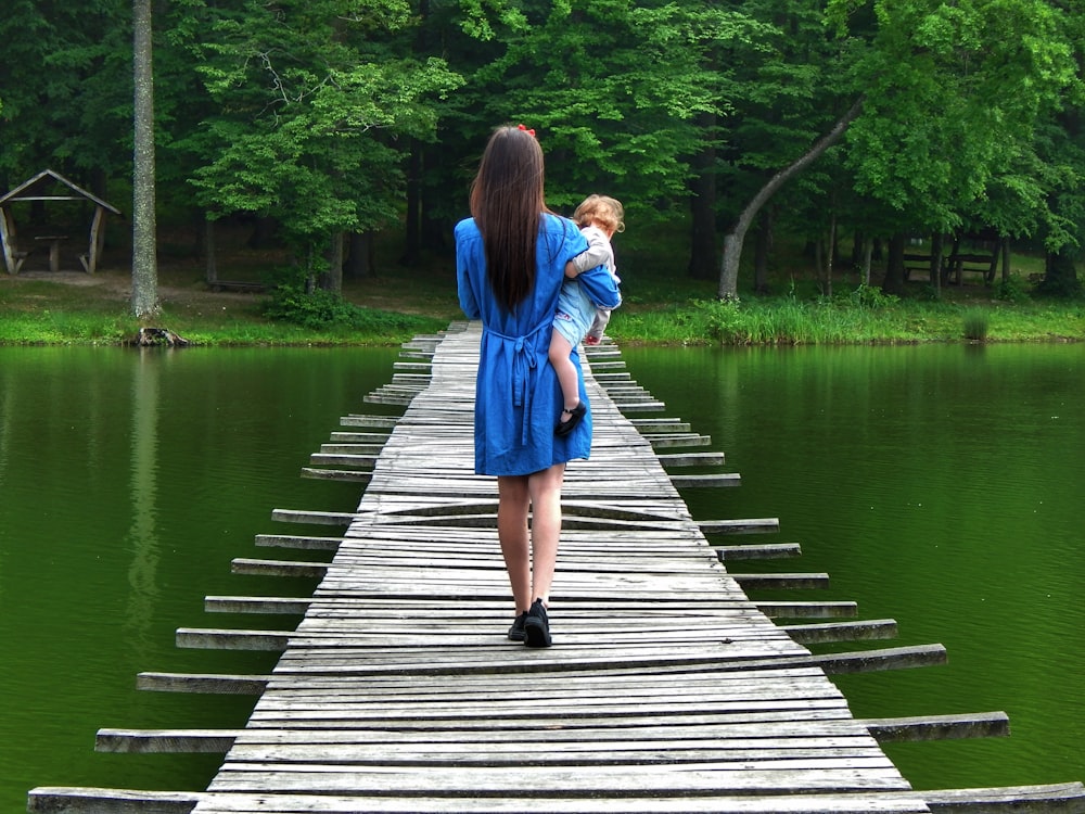 woman walking on brown dock