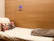 Close-up of a sleek, modern wall bed folded neatly against a cozy bedroom wall.