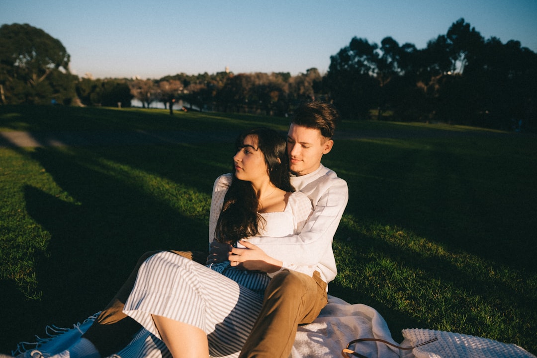 couple sitting on blanket