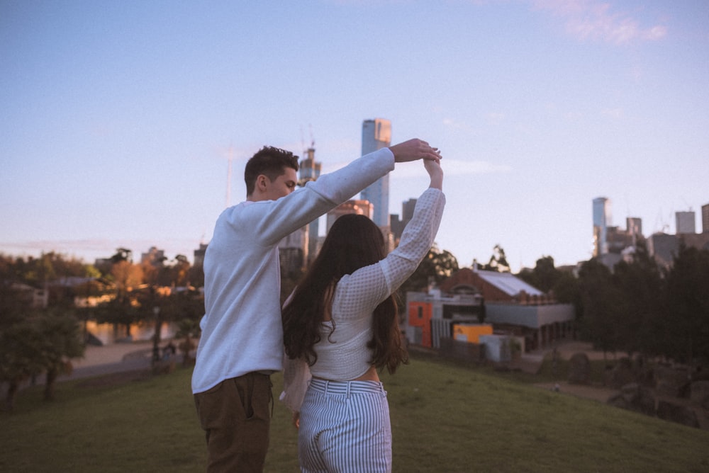 couple dancing during daytime