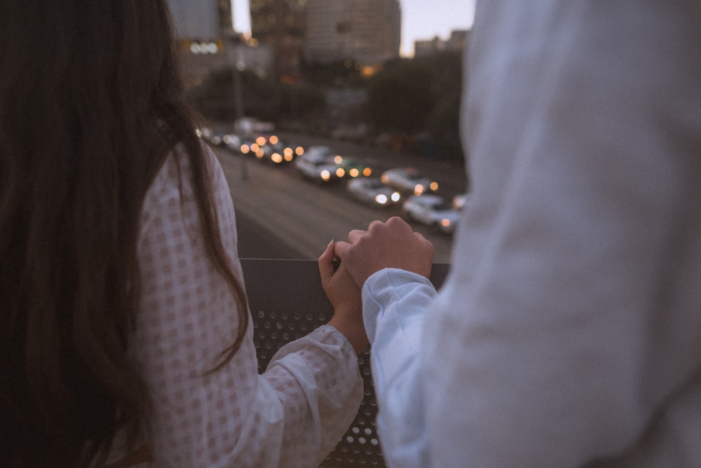 man holding woman's hand