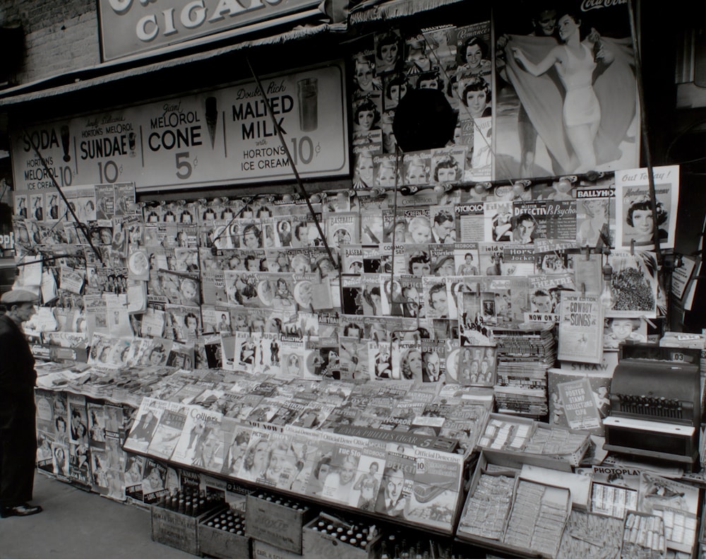 grayscale photo of magazines