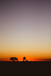 A serene landscape with a sunset, symbolizing transformation and introspection.