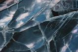 a close up of a broken glass window