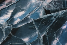 a close up of a broken glass window