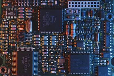 Close-up of a futuristic circuit board with glowing blue and purple highlights.
