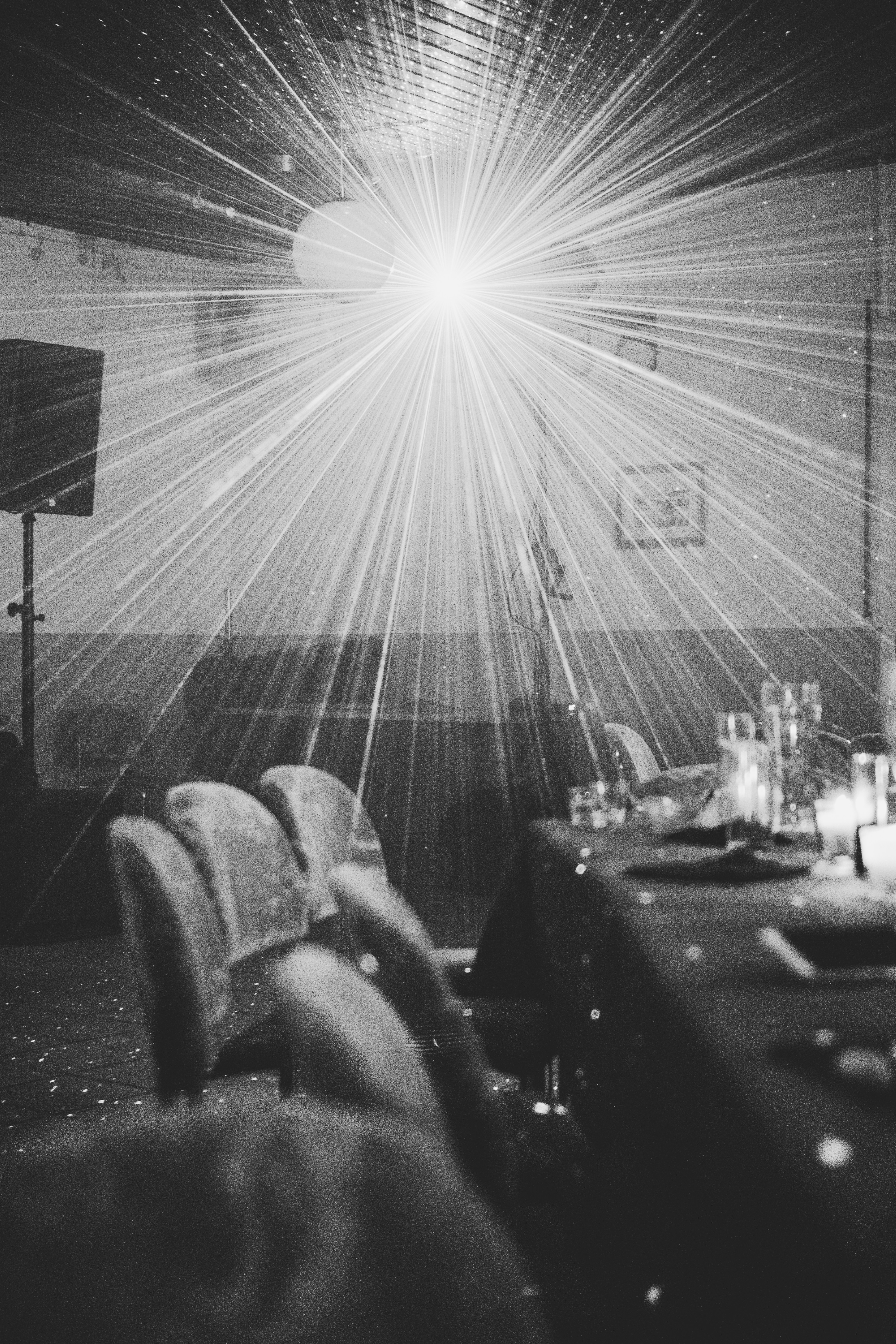 grey scale photography of chairs under ballons