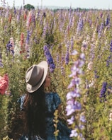 woman standing beside plants