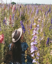 woman standing beside plants
