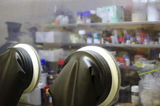 A technician inspecting glove quality in a modern industrial setting.