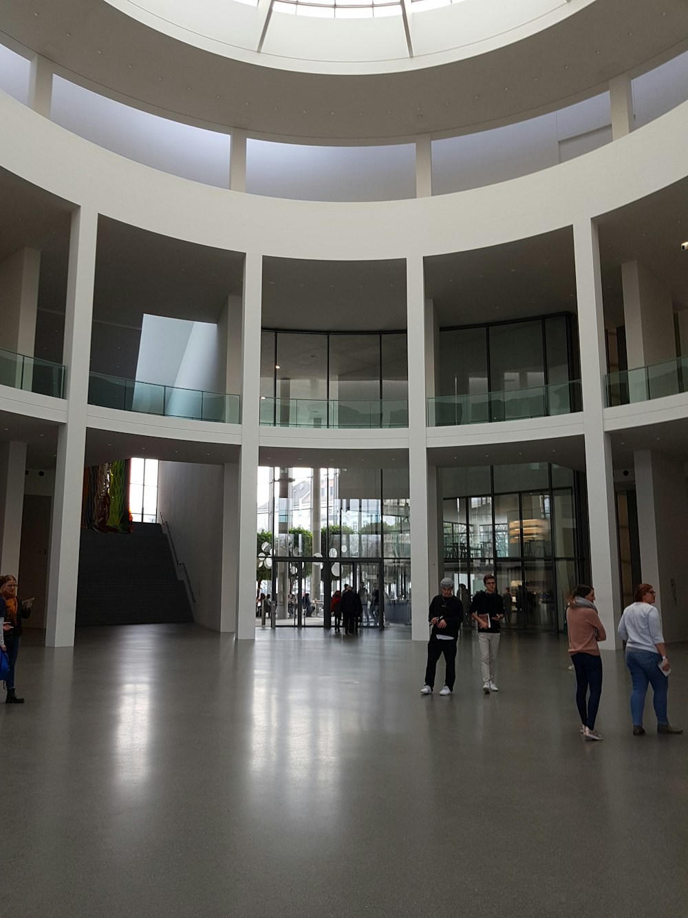 a group of people standing inside of a building