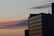 Elegant exterior view of a high-rise serviced apartment building at sunset.