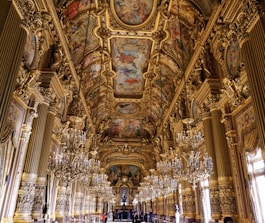 gold hallway with chandeliers