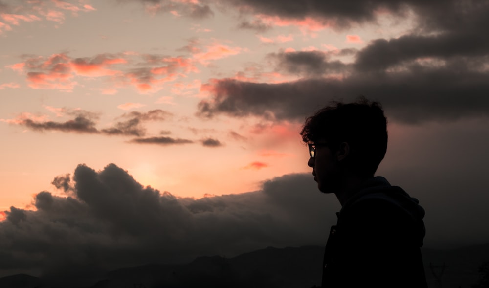 silhouette of man wearing glasses