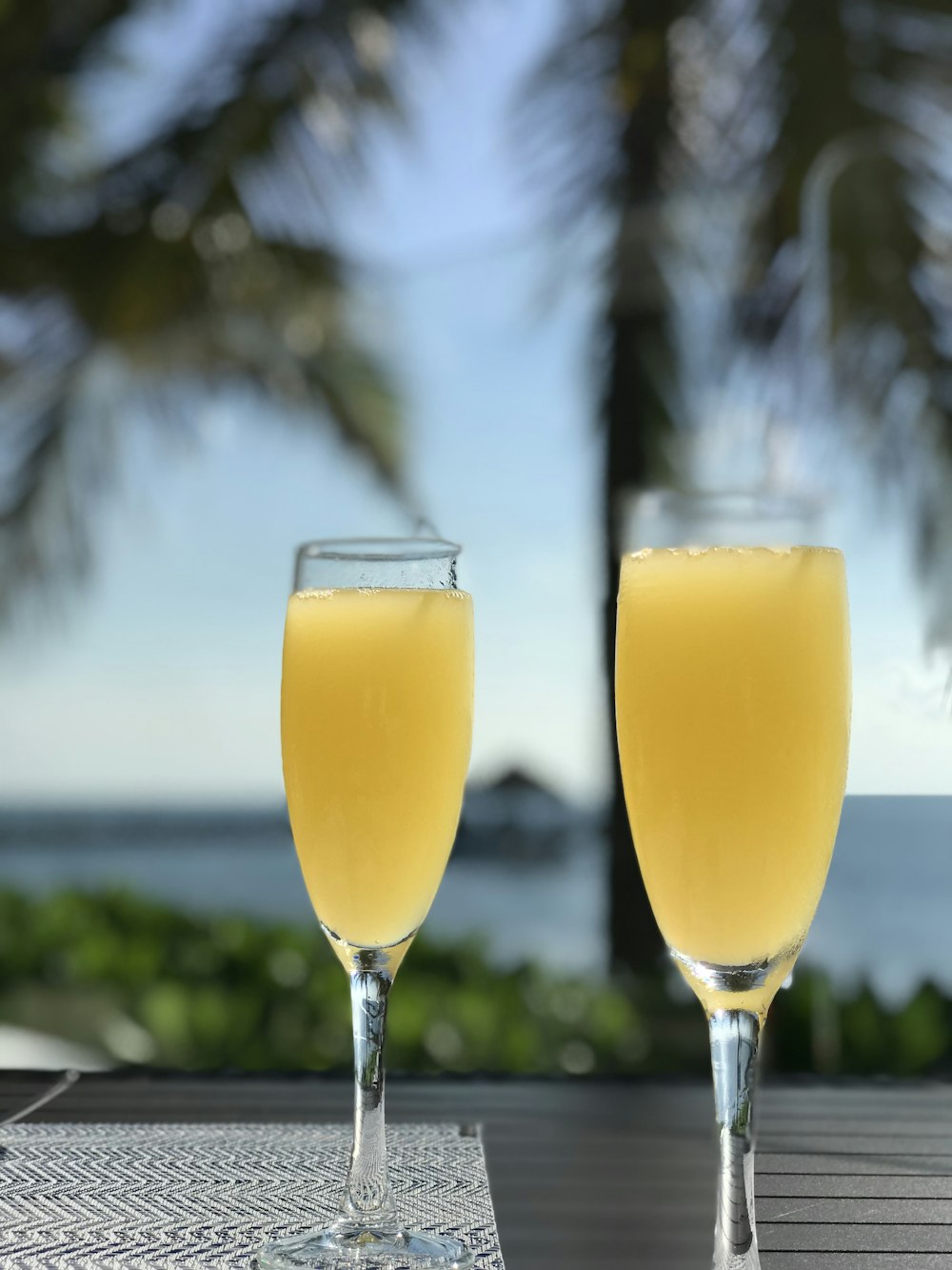 two clear glass footed cups close-up photography