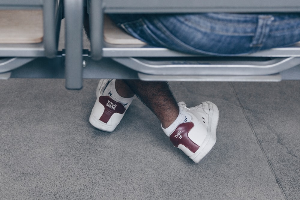 a close up of a person's shoes on the ground