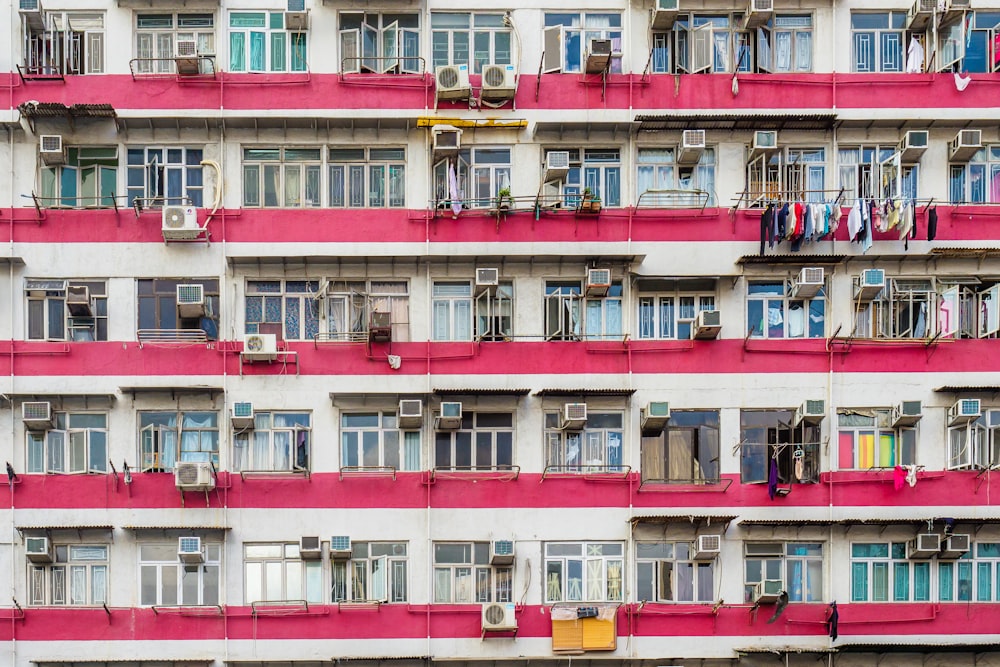 a very tall building with lots of windows and balconies