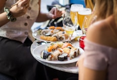 people near foods on table