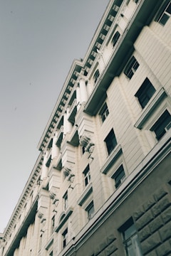 Wide angle shot of a building showcasing bold decorative exterior trims.