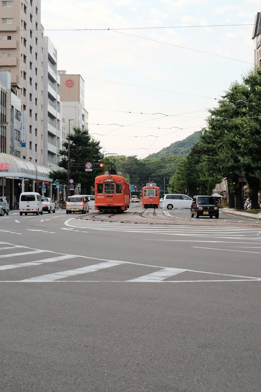 vehicle and tram during daytime