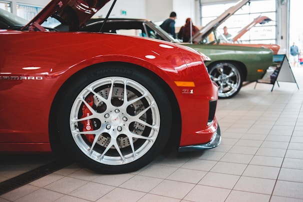 Close-up of striking car-themed accessories on display.