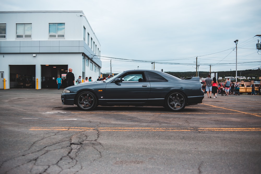 black coupe on a parking lot