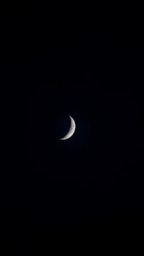 A mystical handcrafted amulet glowing softly under moonlight.