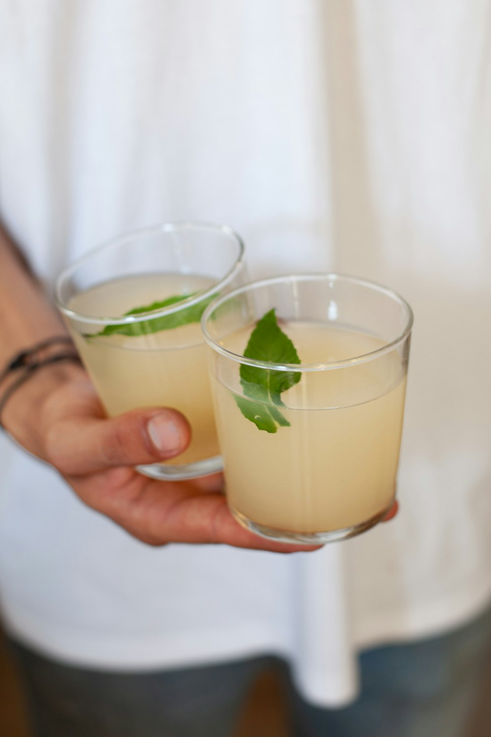 person holding drinking glass